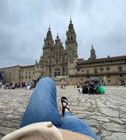 Student relaxing in front of large chapel in Florence Italy